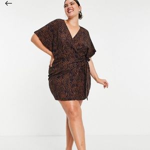 In The Style Plus wrap detail mini dress with belt detail in leopard print